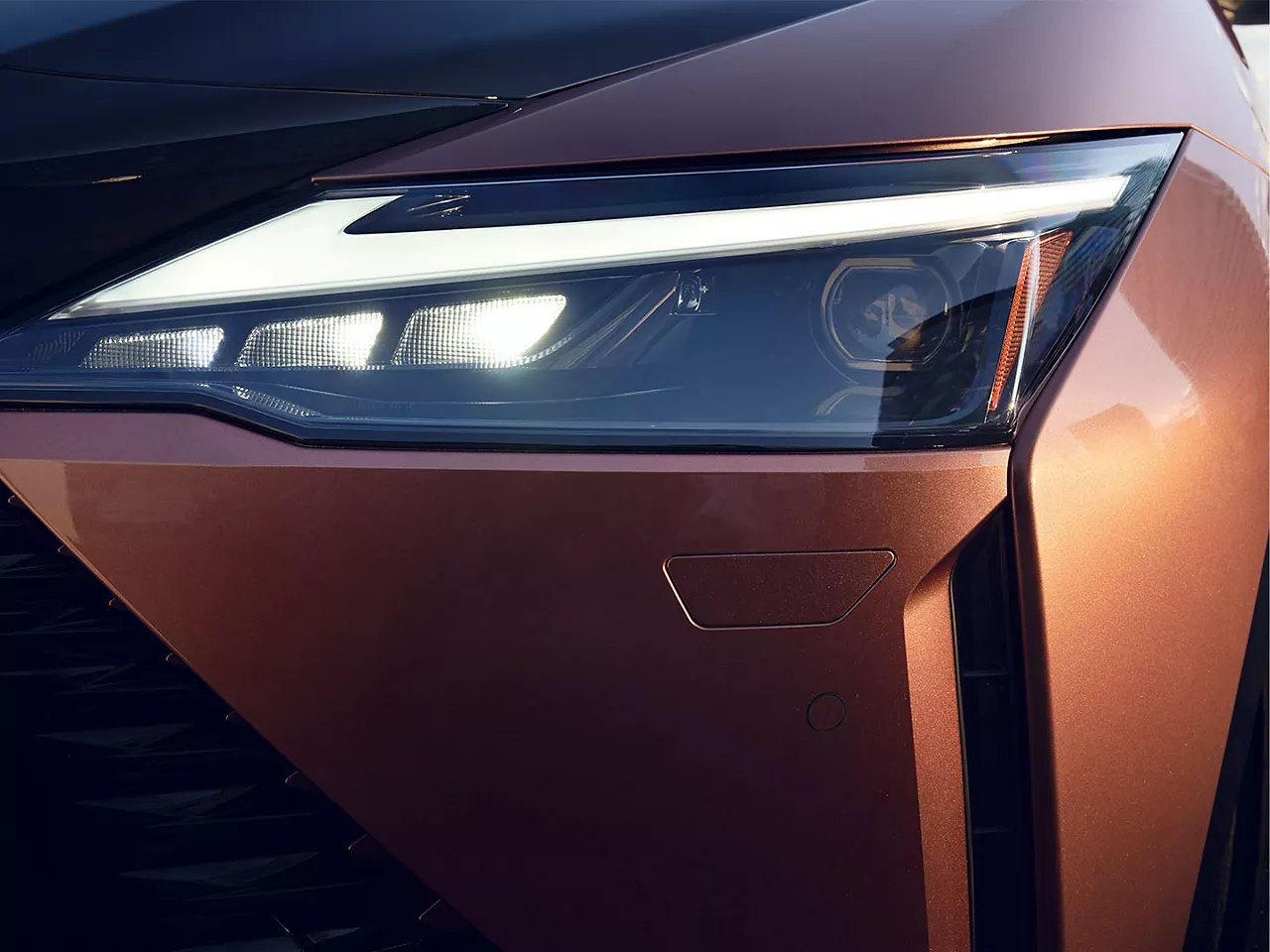 2022-lexus-rz-campaign-presales-ext-feature-overlay-stunning-looks-headlights-4x3-1440x1080.jpg